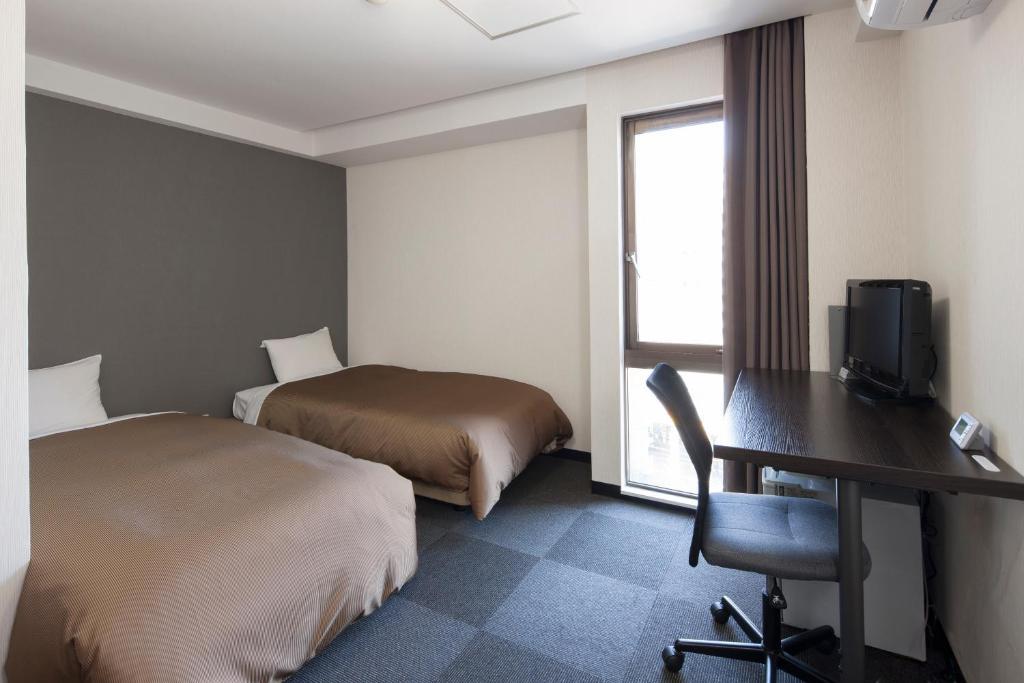 Hotel Plaza Inn Токусима Номер фото
